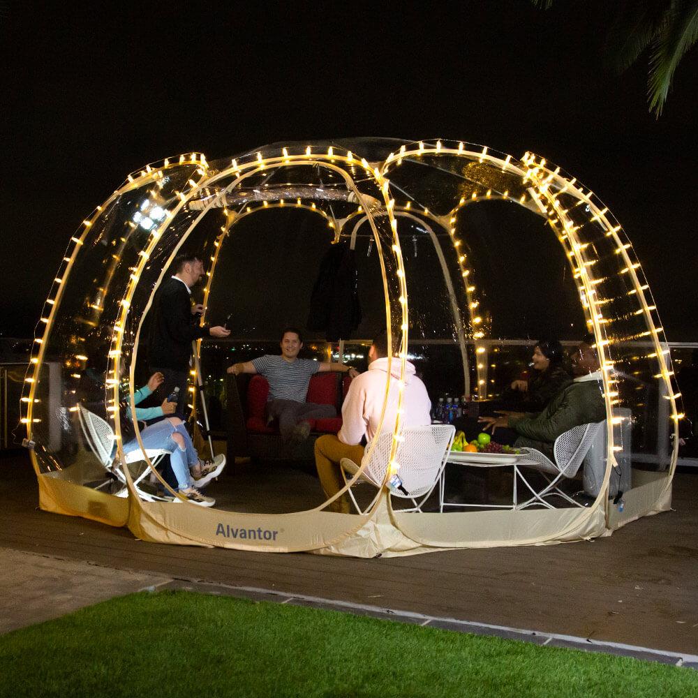 People talking happily during the party in a clear bubble tent with lights LED clip.