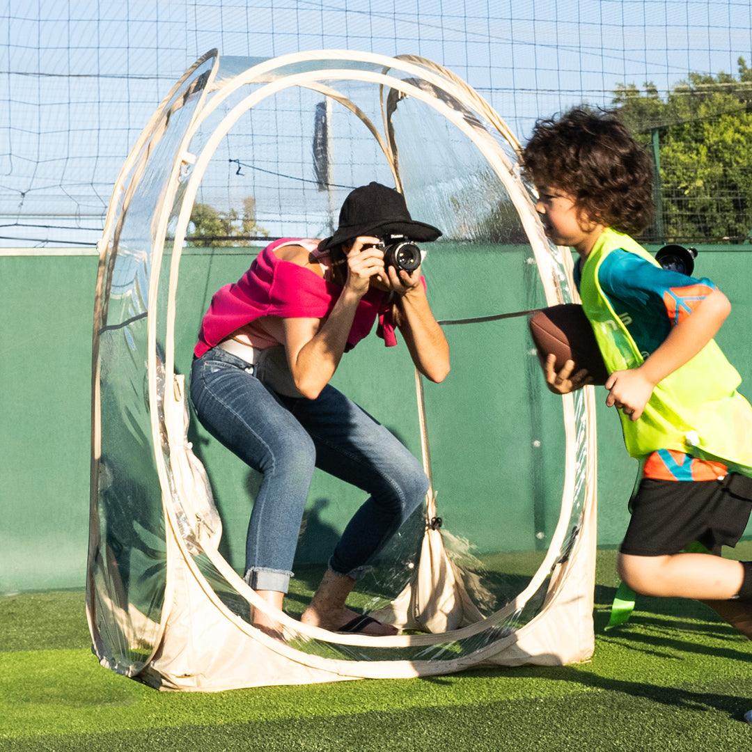 Capture photographic moments of children's movement in a 1-person weatherproof pod.