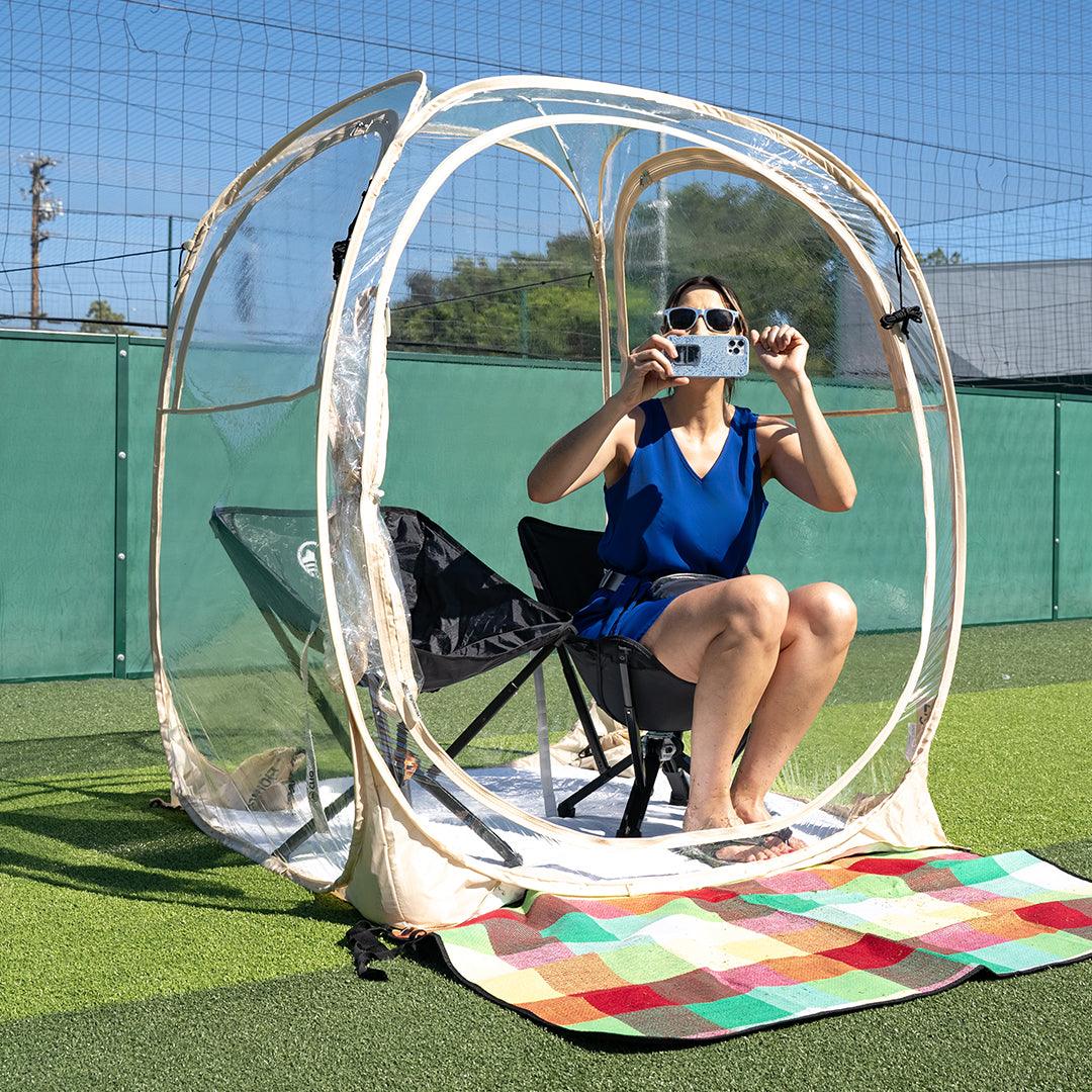 Sit inside a 2-person weatherproof pod, cheer for the competition, and take photos with your smartphone