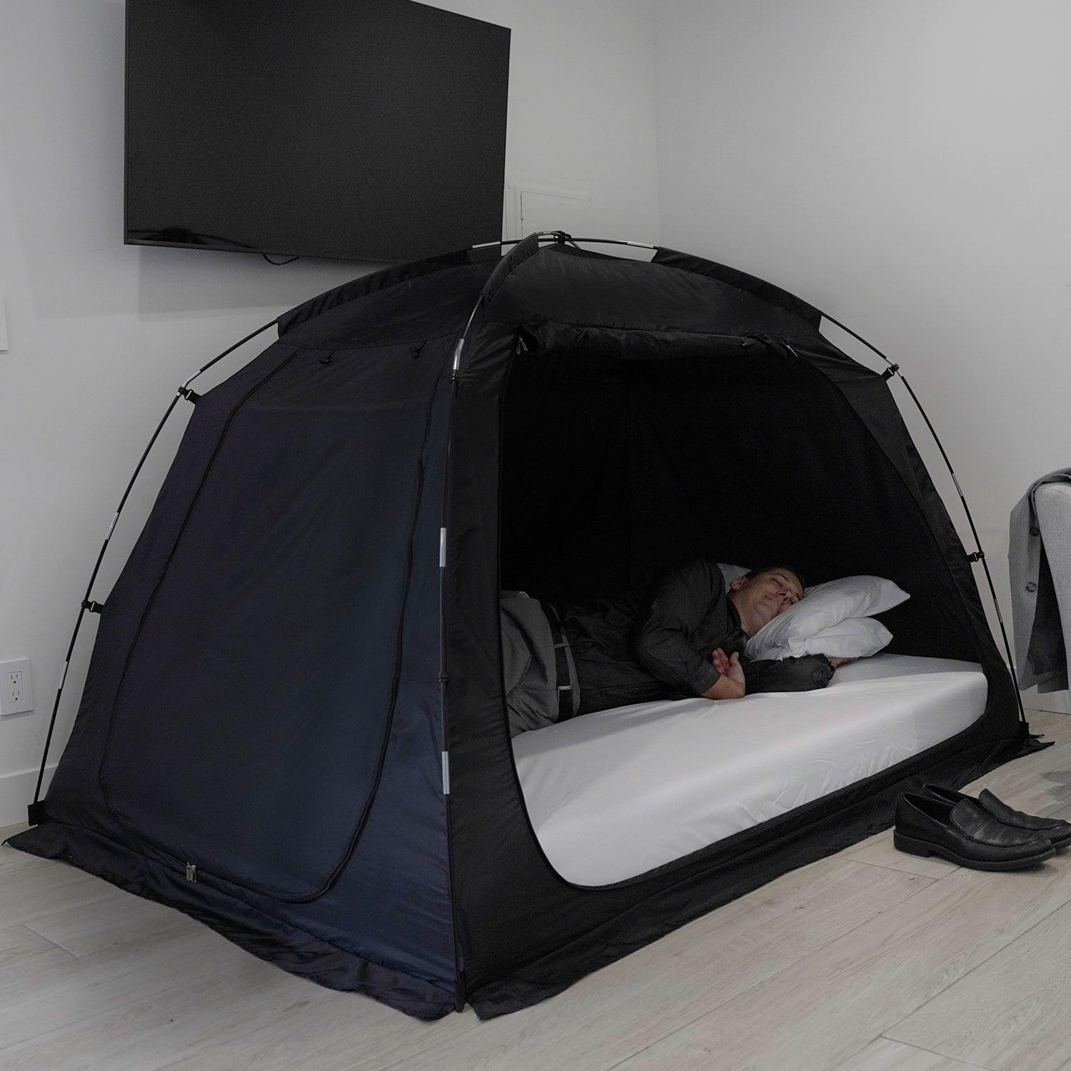 Portable Privacy Bed Tent with a man inside